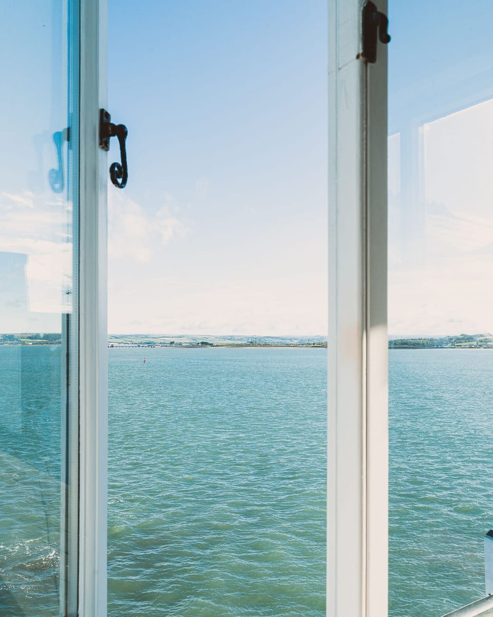 Views of the estuary in the master bedroom at Waters Dream, Devon