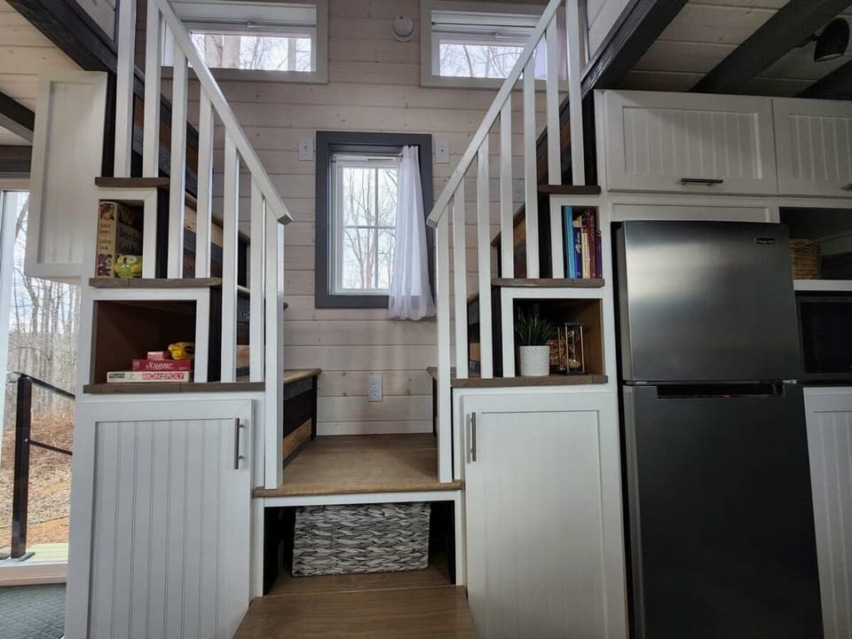 Staircase leading to cozy loft spaces