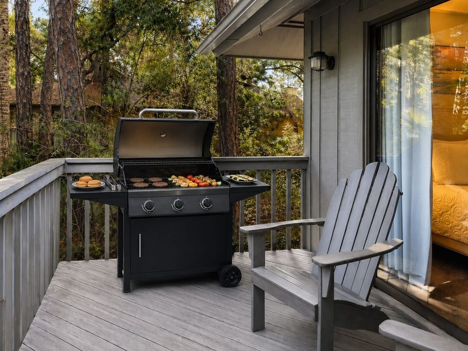 Fire up your private grill on this peaceful deck surrounded by towering trees, where evening cookouts become memorable moments.