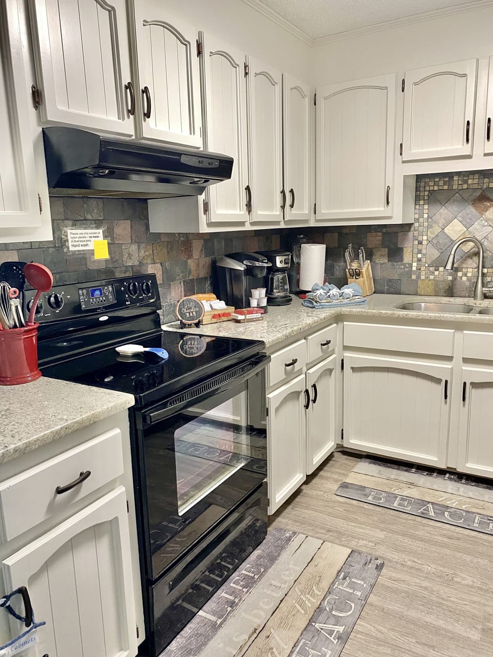 Kitchen stocked with items you’d find in your home for a warm, comfortable stay