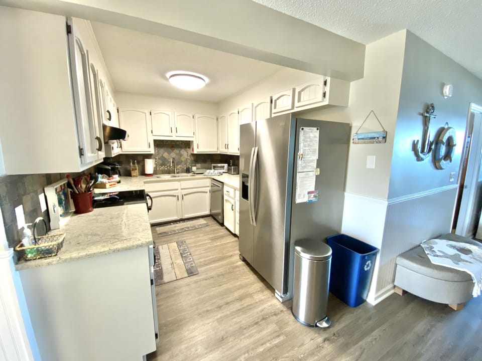 Granite countertops, glass top stove, stainless appliances & 2 coffee pot types