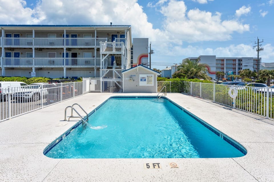 Cool off in this inviting pool with crystal-clear water and plenty of deck space for lounging under the sunny skies.