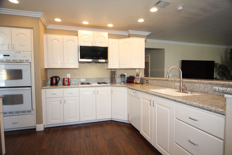 Stocked Kitchen, Plates, Silveware, Cookware. Kitchen Faucet uses On/Off sensor
