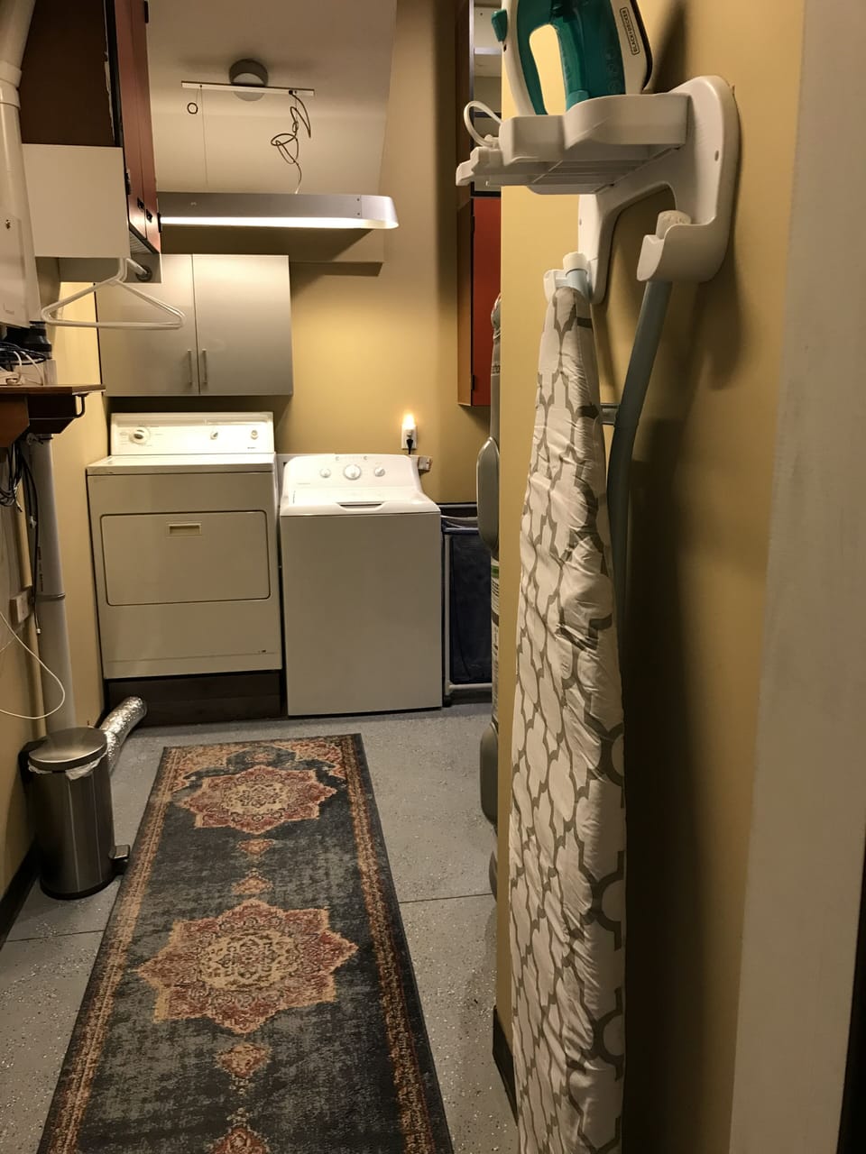 Private laundry facilities with ironing board and iron