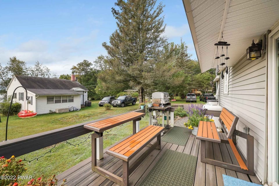 Deck with grill and bench tables