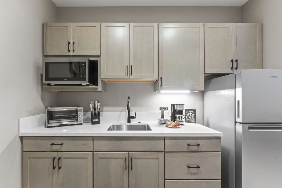 Savor a fresh brew at the Coffee Bar in a sleek kitchenette w/ modern appliances