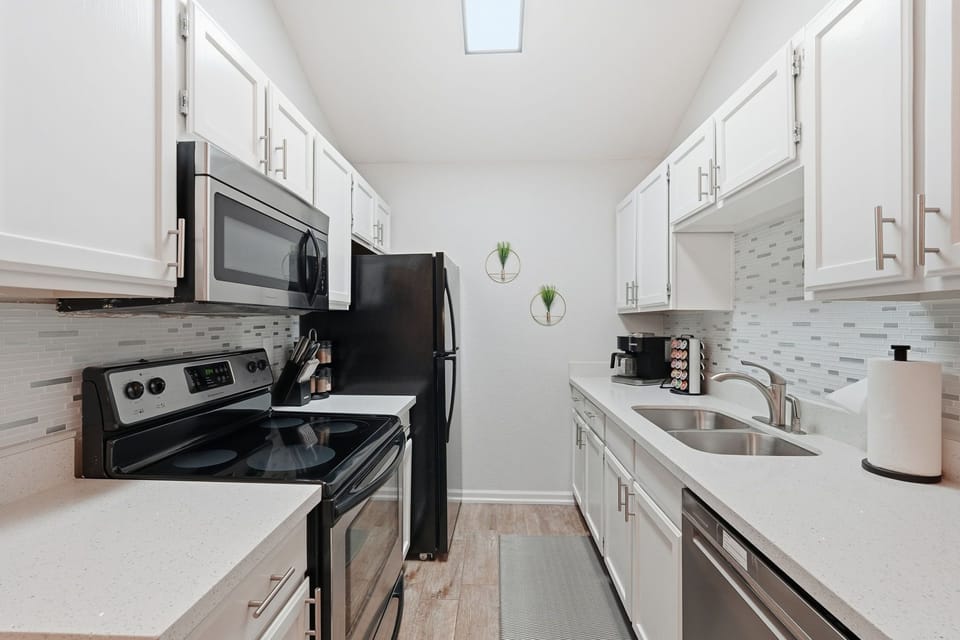 Bright modern kitchen complete with all the essentials for easy meal prep