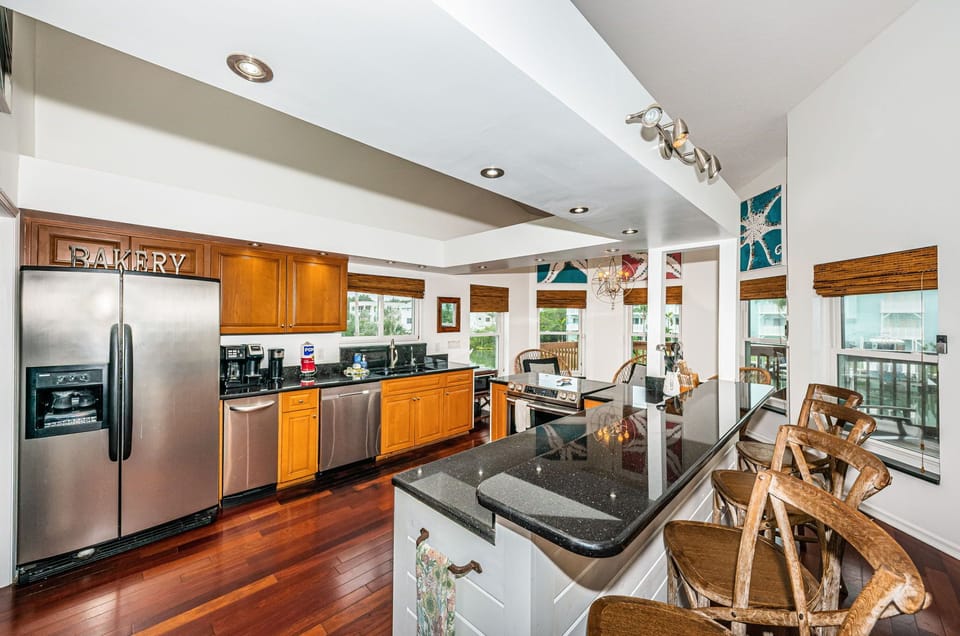 Kitchen with granite and stainless appliances.