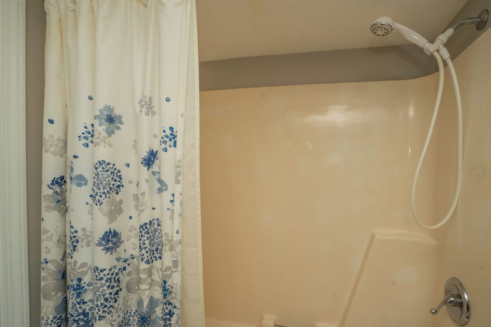 Step into your private shower after a day of adventure. The dual-head system and soothing beige tones create a peaceful space to rinse away the day's travels and refresh.