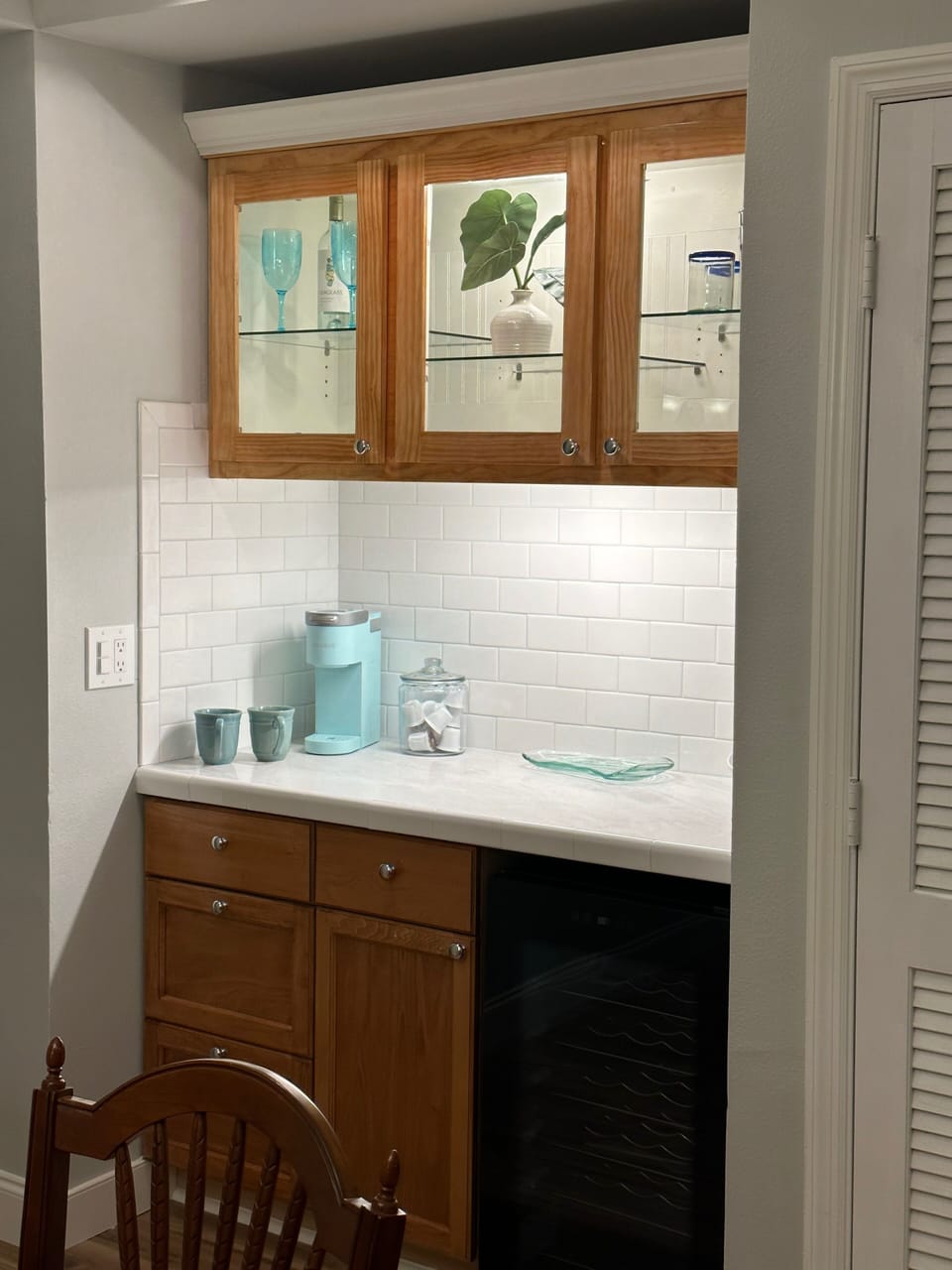 Butler's pantry with wine cooler.