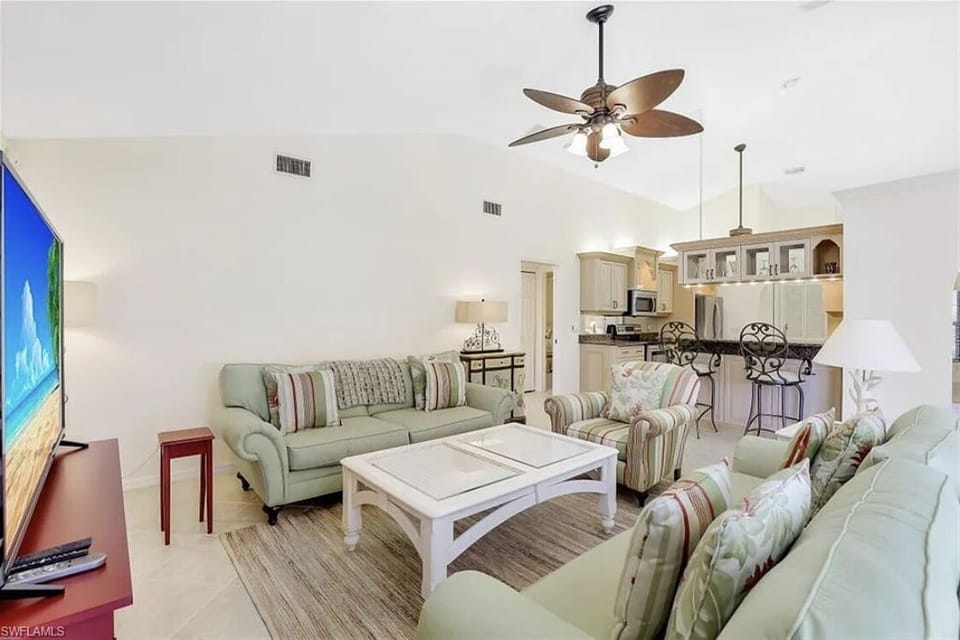 Living room with view of kitchen