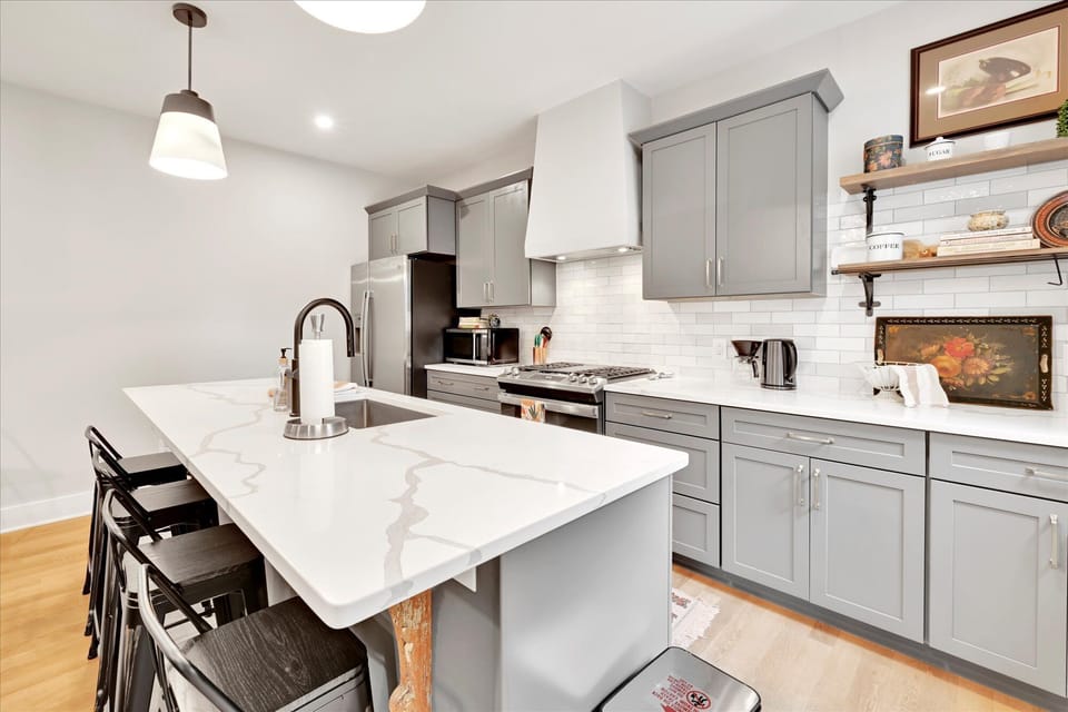 Full kitchen with Quartz countertops and stainless appliances. 