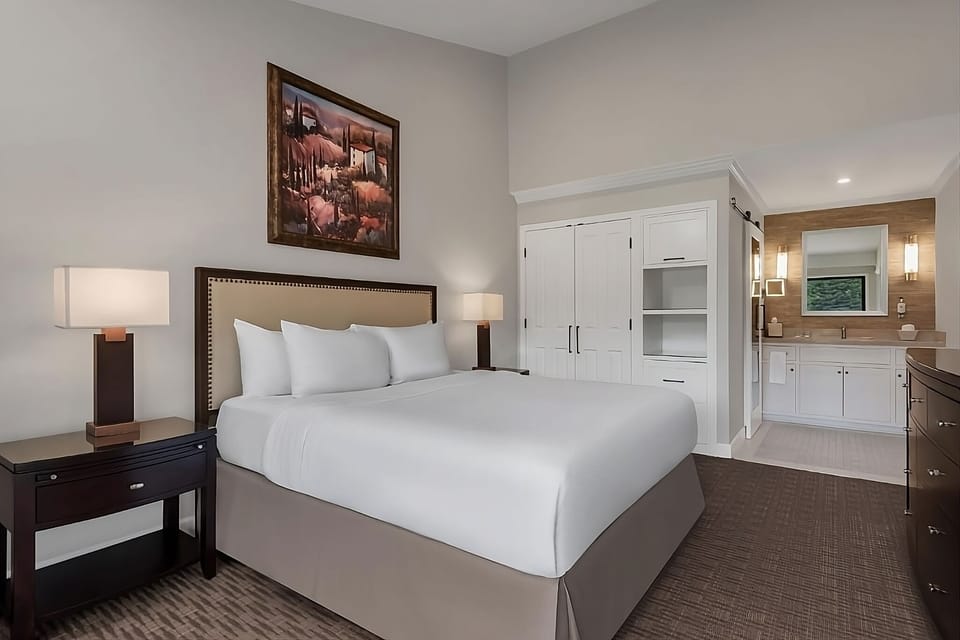 Drift off in a serene room with modern built-in storage.