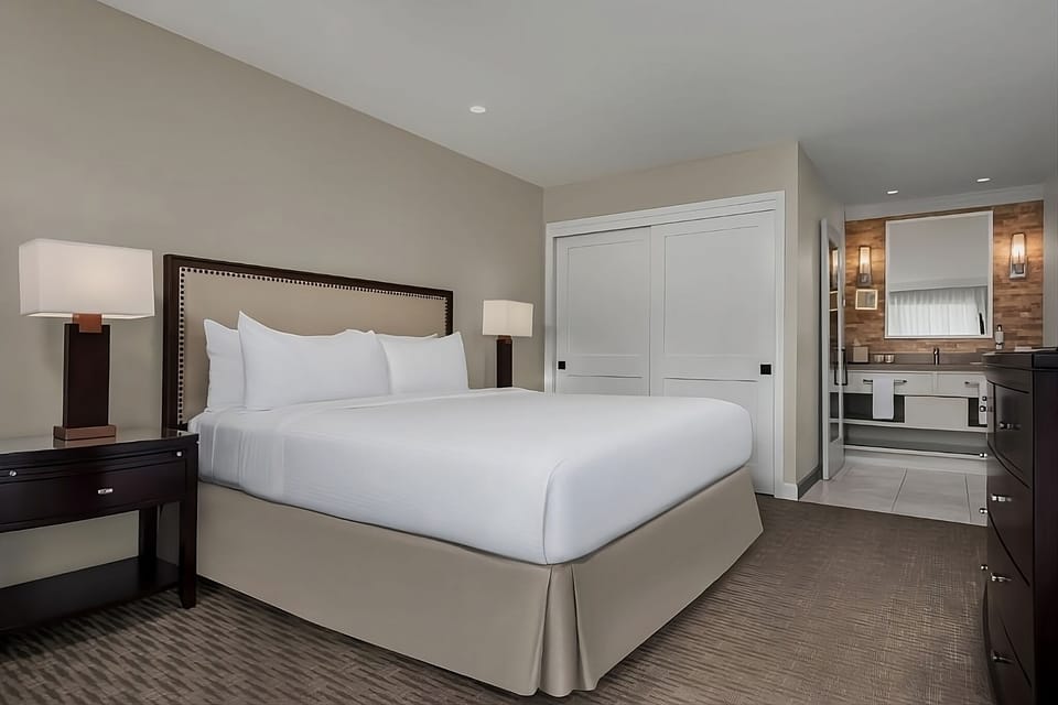 Sink into plush bedding with a spacious suite-style layout.