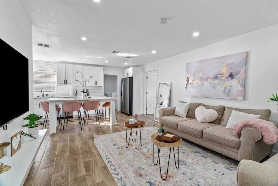 Bright open-concept living room and kitchen, perfect for cooking, dining, and relaxing together.