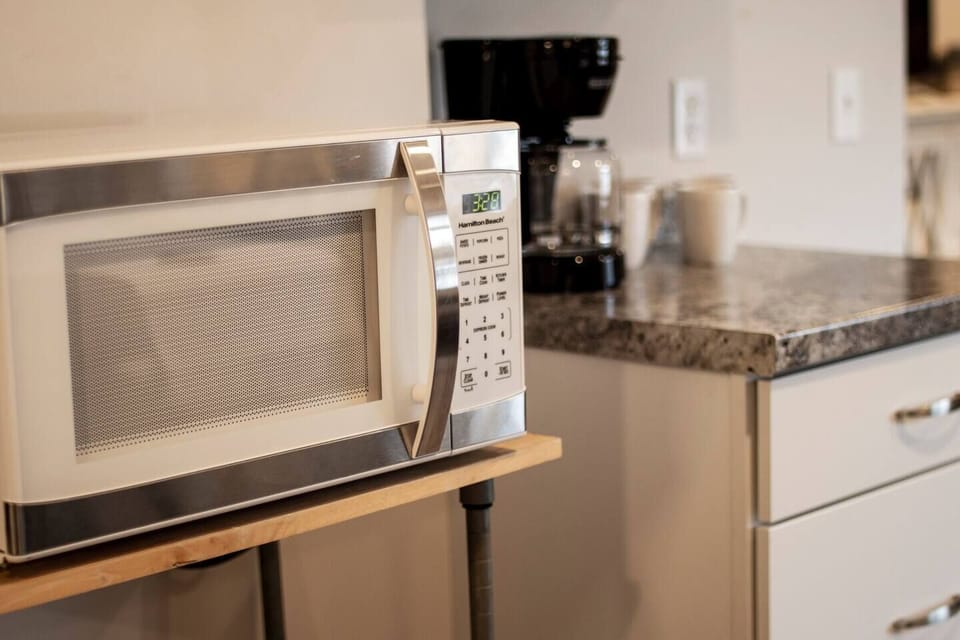 The fully equipped kitchen with granite countertops is ready for your MasterChef skills.