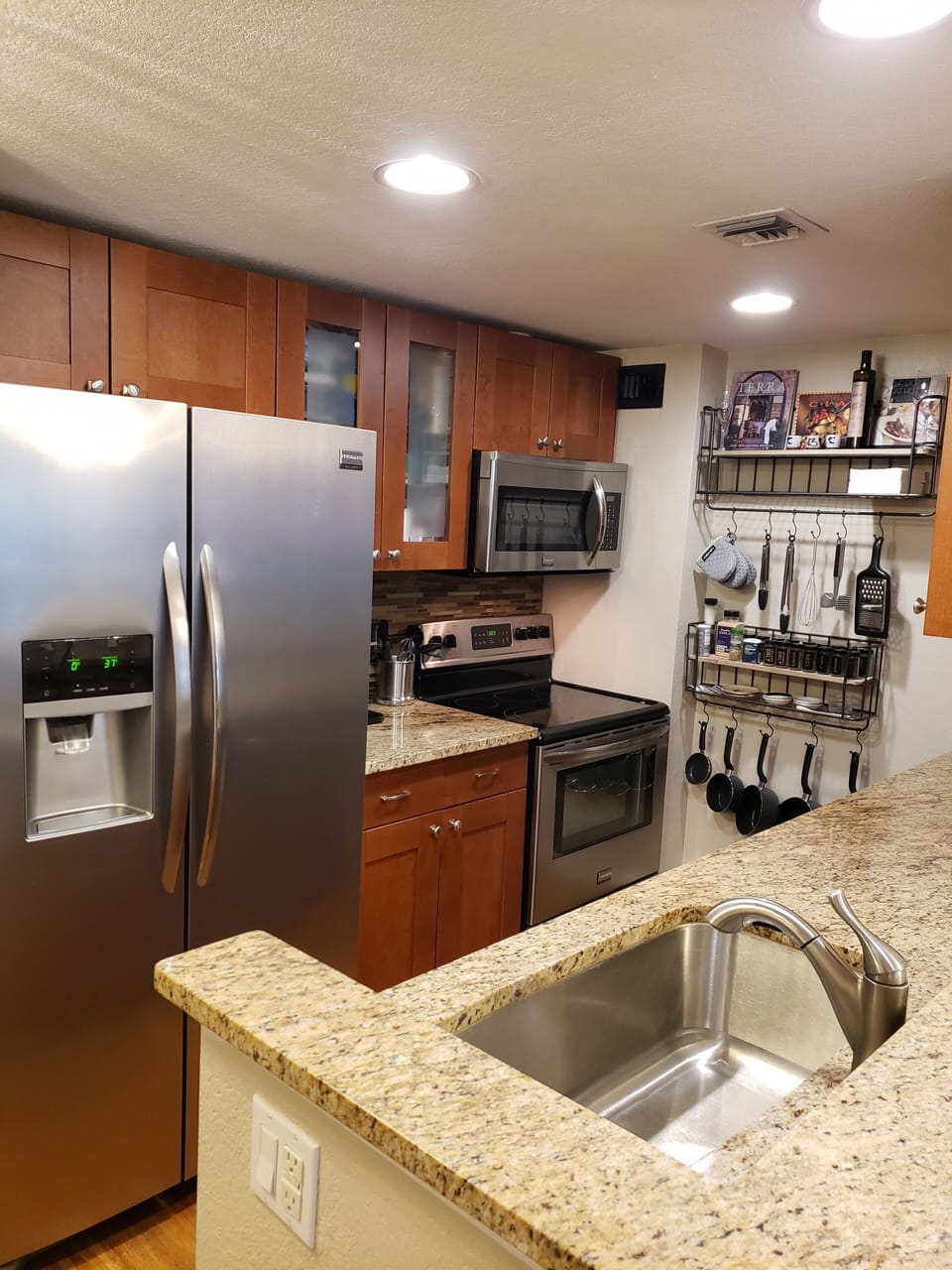 Fully Stocked Kitchen w/dishwasher, fridge with filtered water & Ice maker.