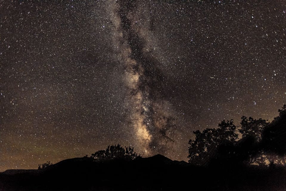 The Milky Way stretches across the night sky. 