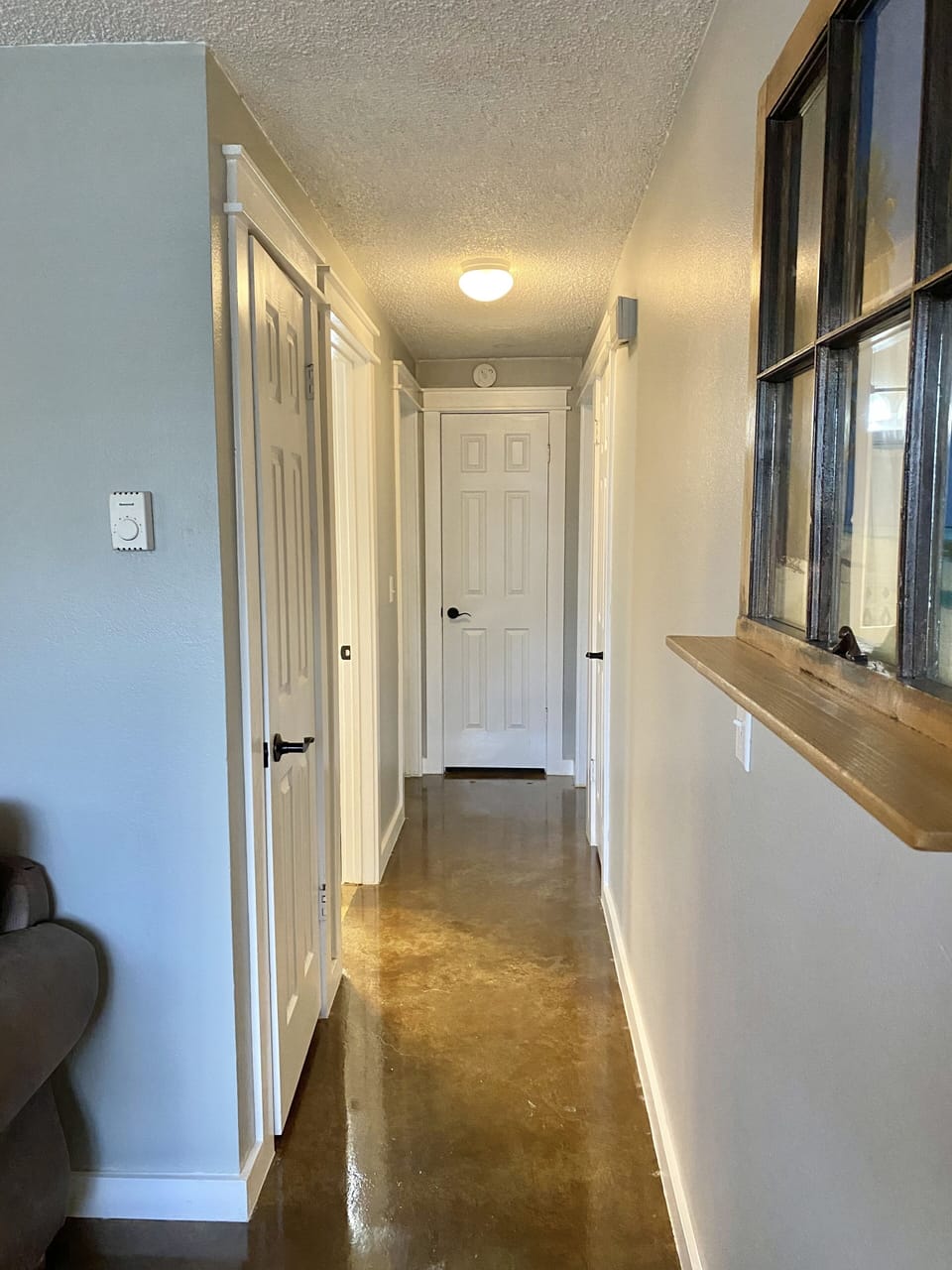 Hallway to bathroom and bedrooms