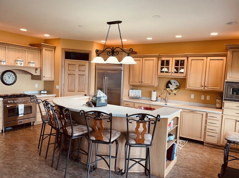 Chef’s kitchen fully equipped with all utensils and commercial-grade appliances.