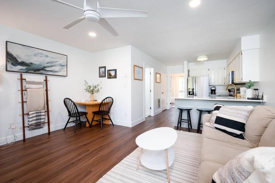 The open-concept living space, complete with a dining area, facilitates effortless conversation with family and friends.