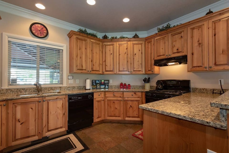 Prepare meals with ease using the provided knife set, coffee maker, double sink, and a selection of kitchen utensils, ensuring a seamless cooking experience during your stay.