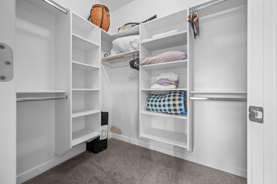 Large walk-in closet with plenty of storage for extended stays.