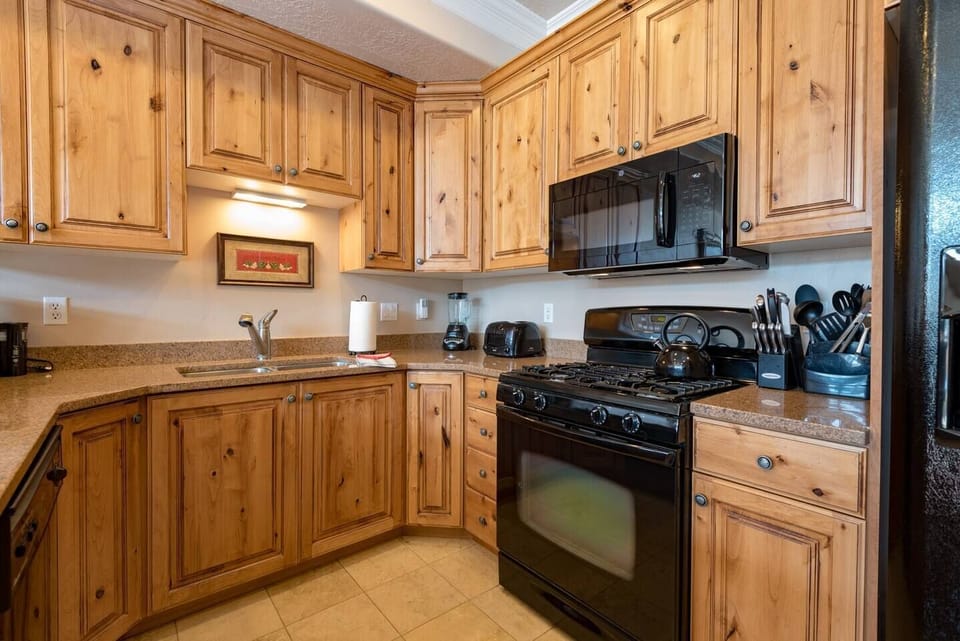 Cook your favorite meals in a kitchen bathed in natural light that enhance the culinary experience.