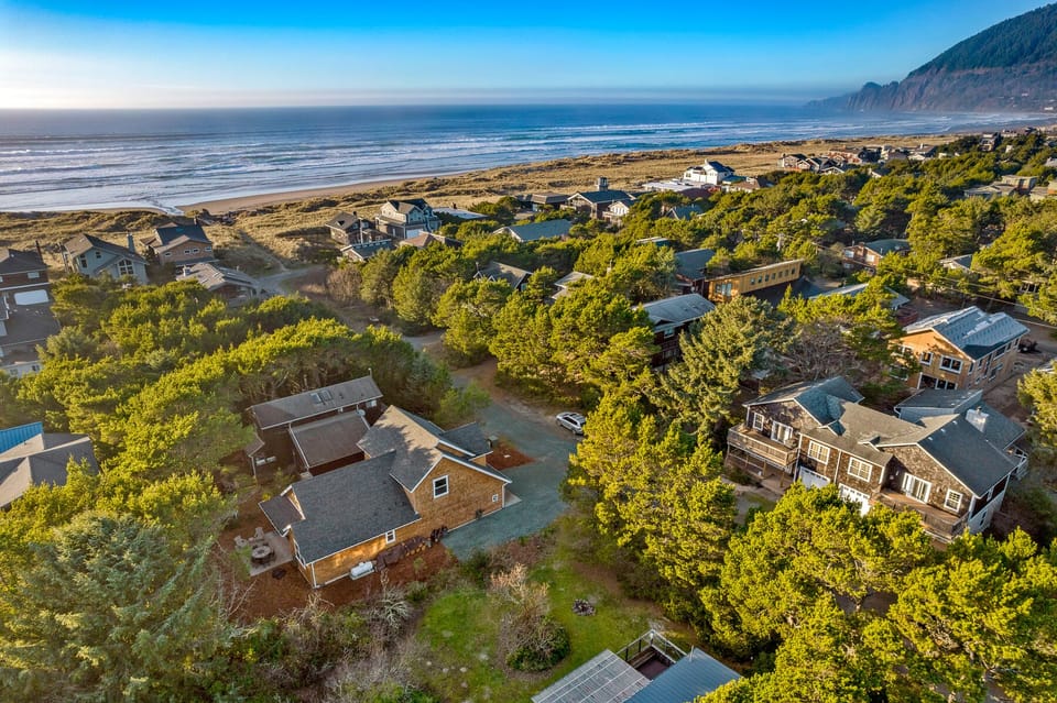 Ohana in foreground with miles of open beach a 3 minute walk to the west
