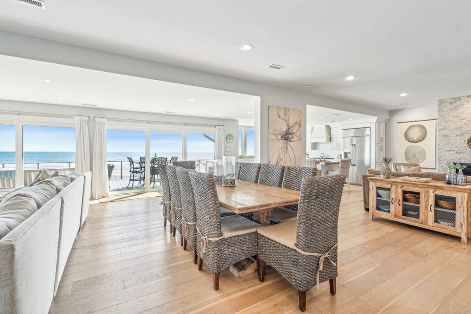Dining table with seating for ten to enjoy a meal together, while taking in the ocean views.