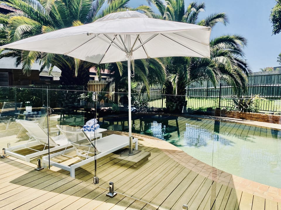 Relax by your own private palm fringed heated pool.