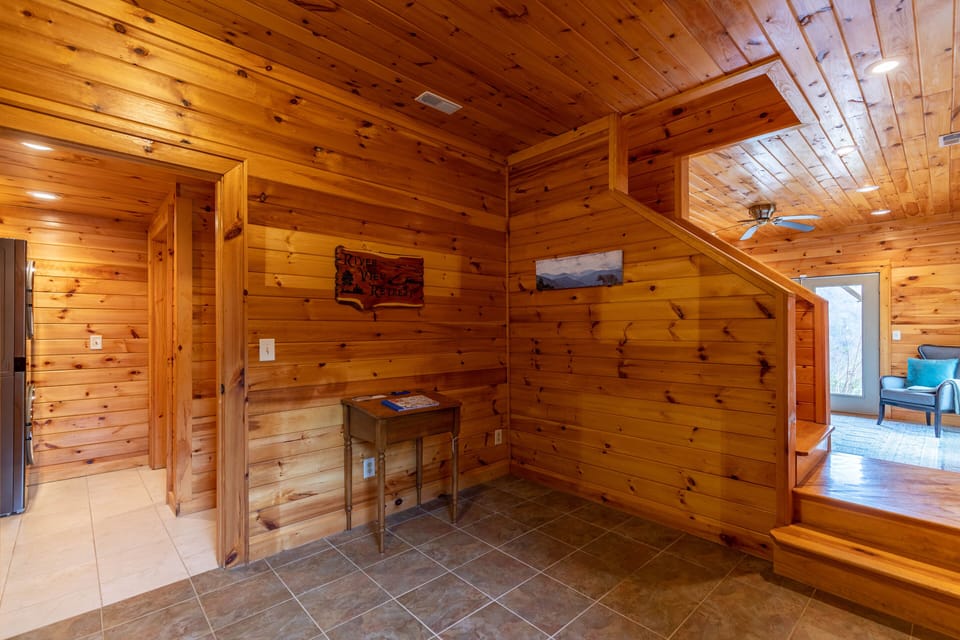 Warm knotty pine surrounds you from the moment you step inside River View Retreat, setting the cabin mood right away.