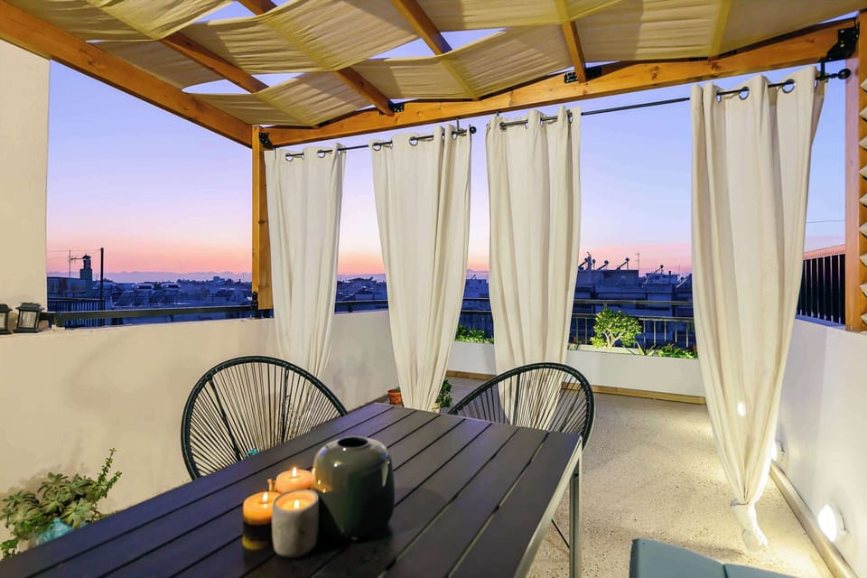 Savor the breathtaking view from the balcony, enhanced by the warmth of the sunset