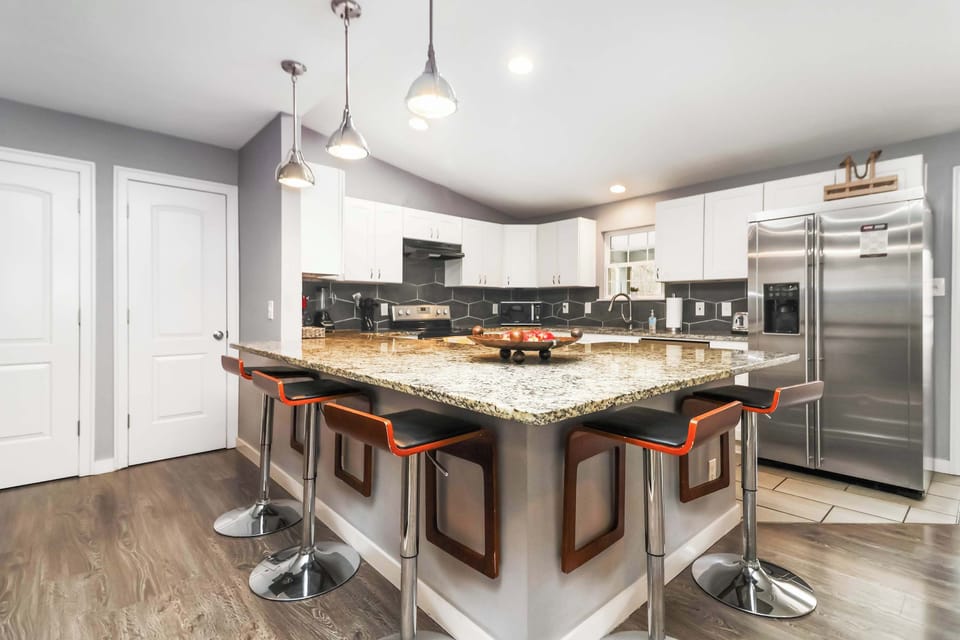 Modern kitchen with granite island and bar seating