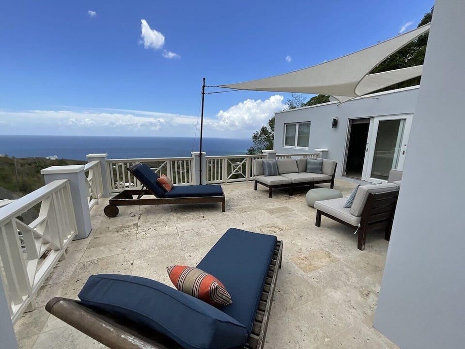 Private deck with ocean view overlooking pool area (1)