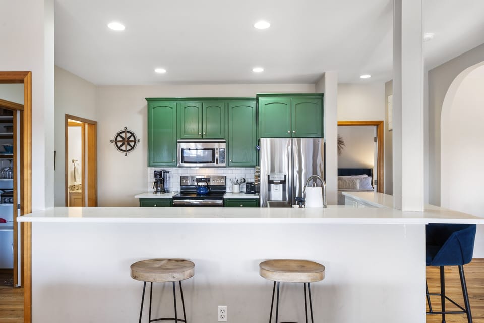 Expand your guest list w/ kitchen counters that can double as addtl dining area.
