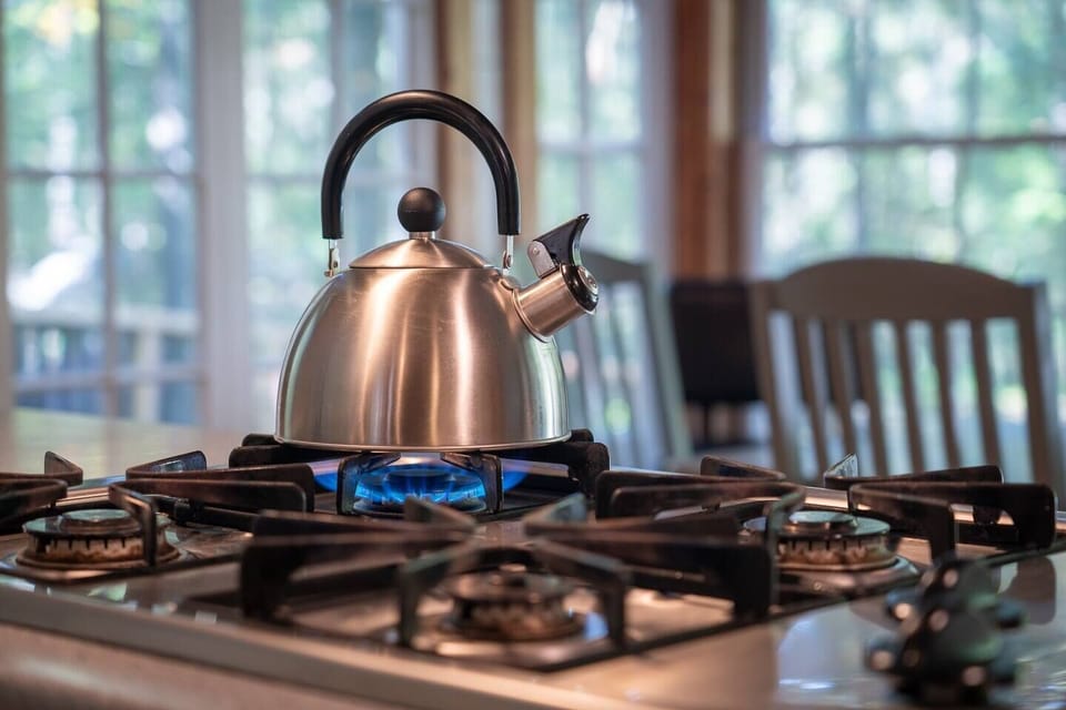 Boil water for fresh, french-press organic coffee w/ half&half