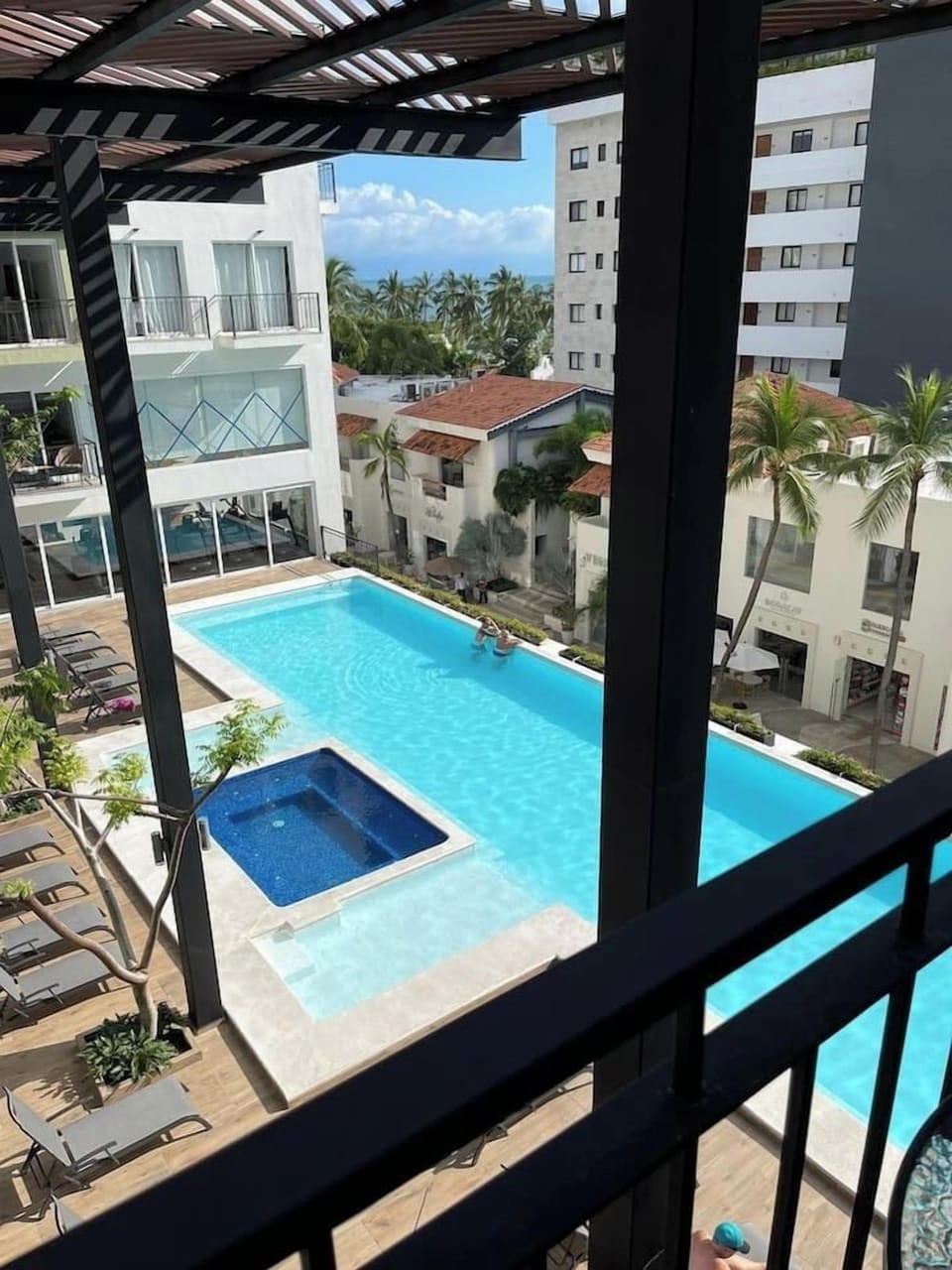 2 nd floor pool with jacuzzi and partial ocean view