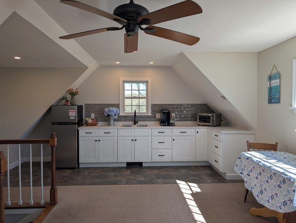 Kitchenette with oversized toaster oven, microwave, keurig, and hot plate