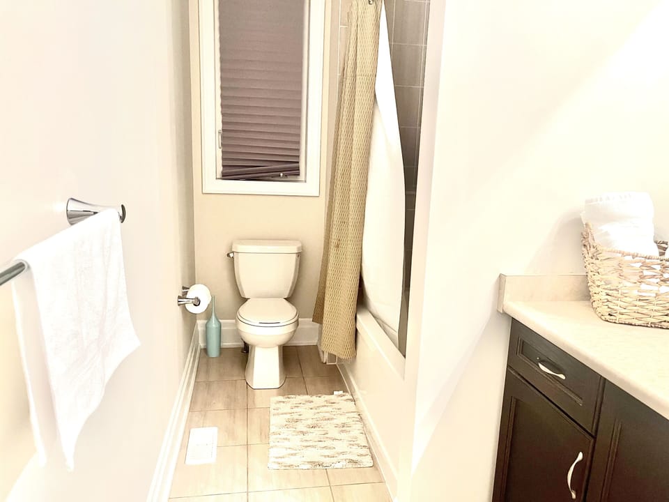 Clean bathroom with a bathtub
