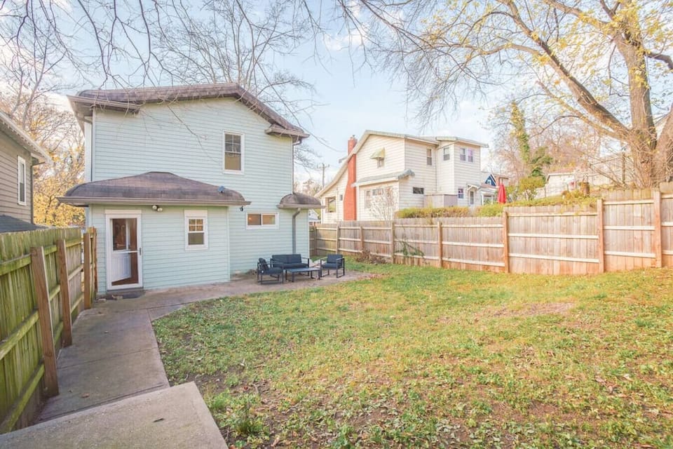 Fully fenced yard with outdoor furniture