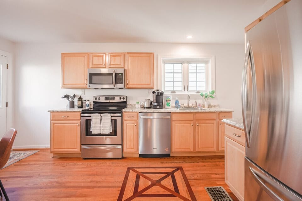 Fully stocked kitchen with stainless steel appliances