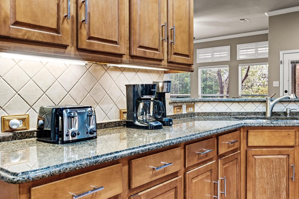 Beautiful open concept kitchen/dining/living spilling into gorgeous back yard 