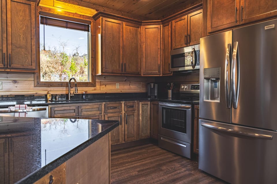 Fully equipped kitchen with stainless steel appliances. 