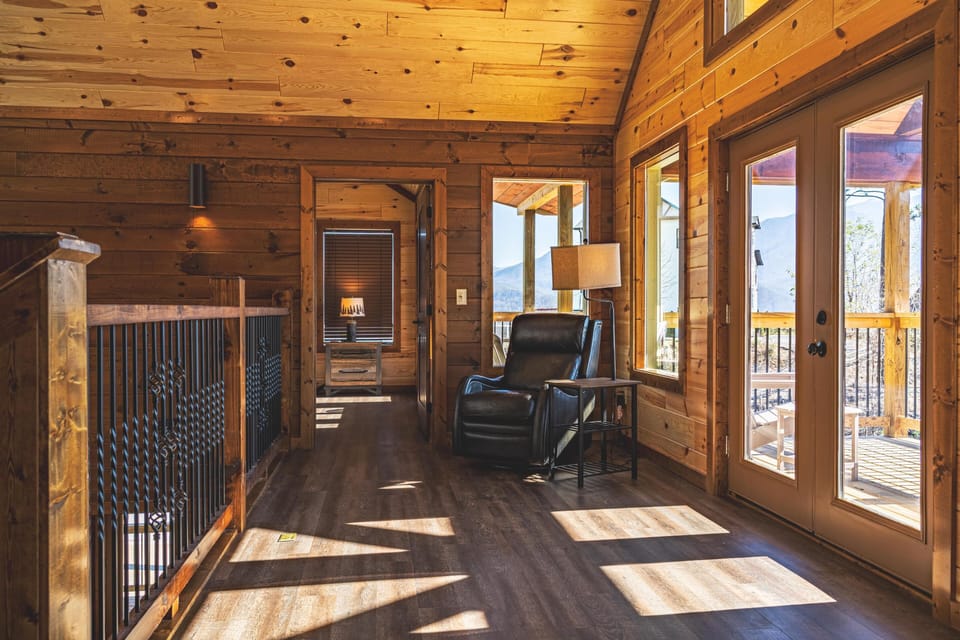 Upper floor seating area with electric recliner and mountain views to relax by. 