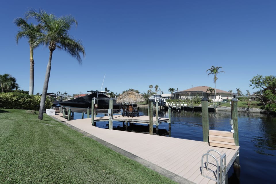 Boat dock with lift and tiki bar