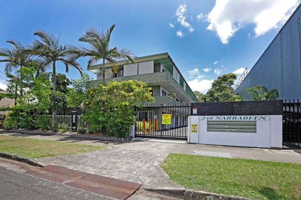 Entrance: Step into paradise with lush greenery and secure access to your tropical retreat!
