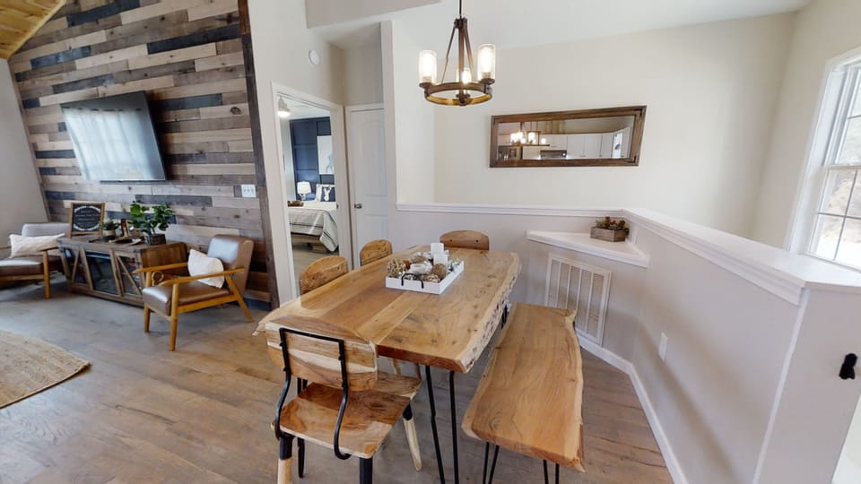 Gather around the large dining table for meals with a view of the cove.