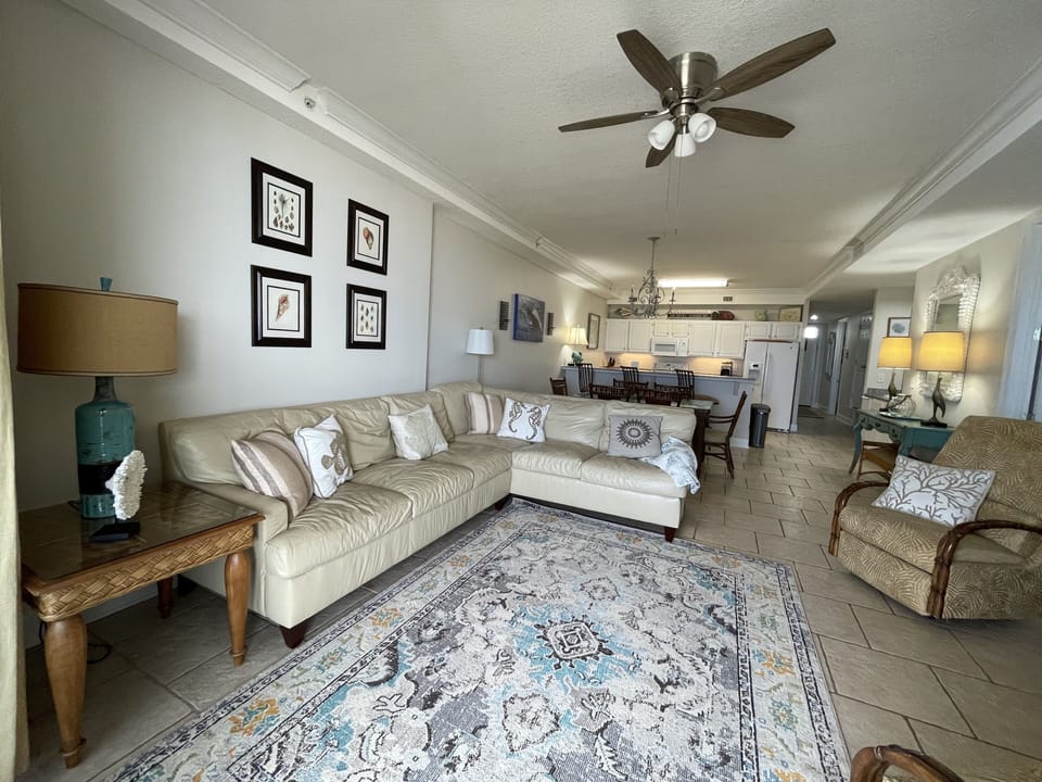 Living room with large leather sectional, 2 recliners 