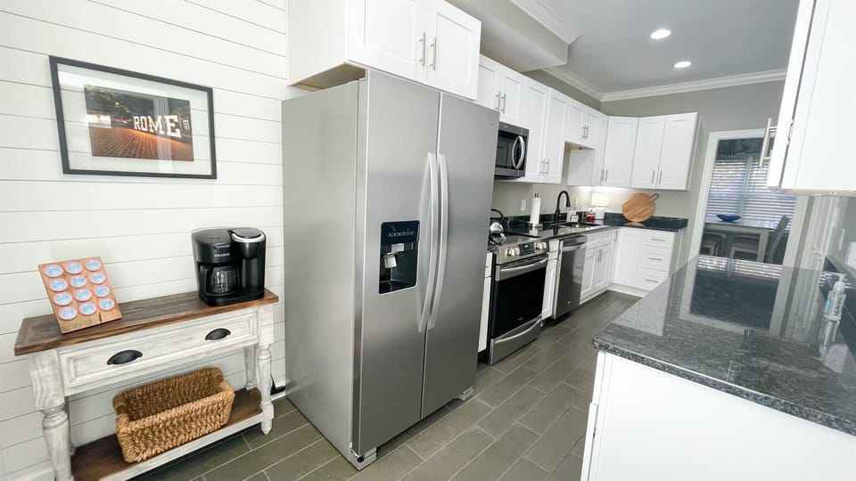 Large kitchen with a stocked coffee bar
